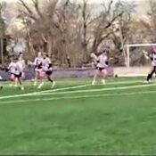 Westminster Lacrosse team plays on the field.