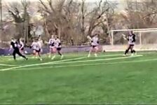 Westminster Lacrosse team plays on the field.