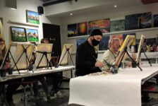 The Paint Mixer, a local art studio, leads participants through a wine and paint night called Fire Sun.