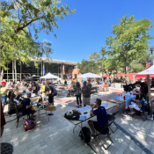 Richer Commons is filled with students walking round multiple tables.