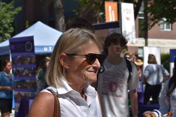 President Beth Dobkin smiling at the Student Wellness Fair in Richer Commons.