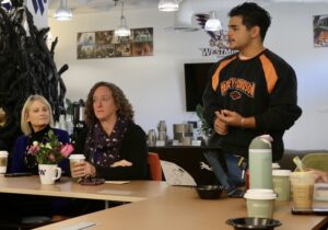 Three people in the SEB Suite in Shaw at the Doughnuts and Discussions event hosted by ASW.