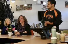 Three people in the SEB Suite in Shaw at the Doughnuts and Discussions event hosted by ASW.